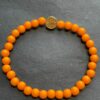 AVL armband oranje met gouden bedel